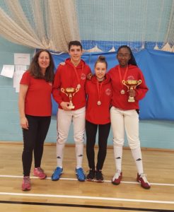 Benjamin Urdrzal, Emilia Lukaite and Teagan William-Stuart with coach Linda Strachan