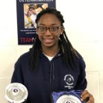 Teagan Williams-Stuart with the foil team and individual trophies